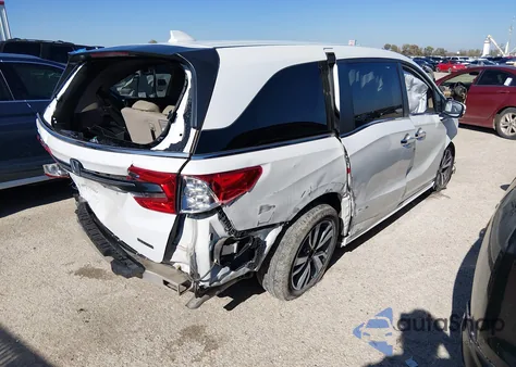 2021 Honda Odyssey Touring z USA, uszkodzony, nr VIN 5FNRL6H87MB034875